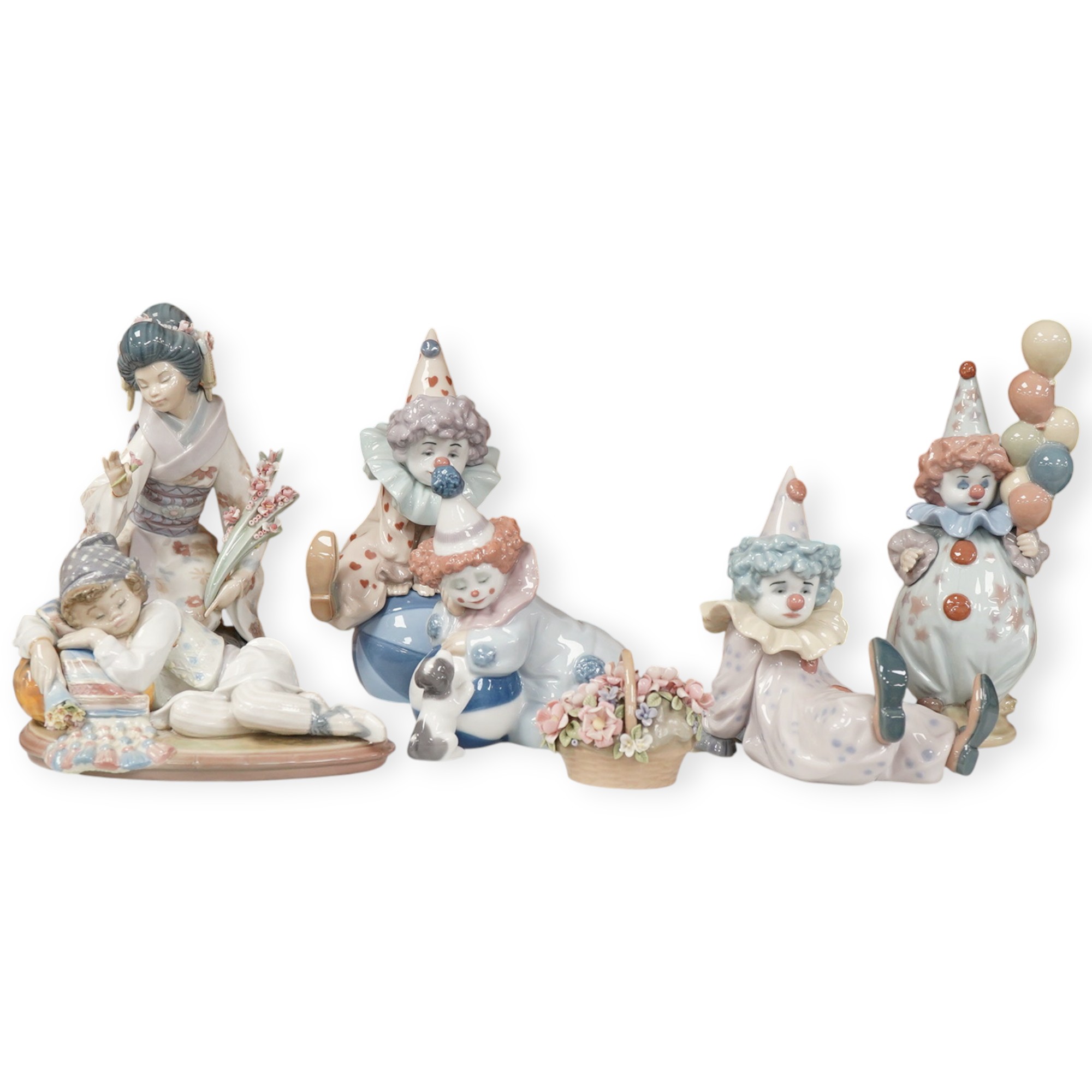 Seven Lladro figures, four clowns, a Geisha girl, a reclining girl and a small basket of flowers
